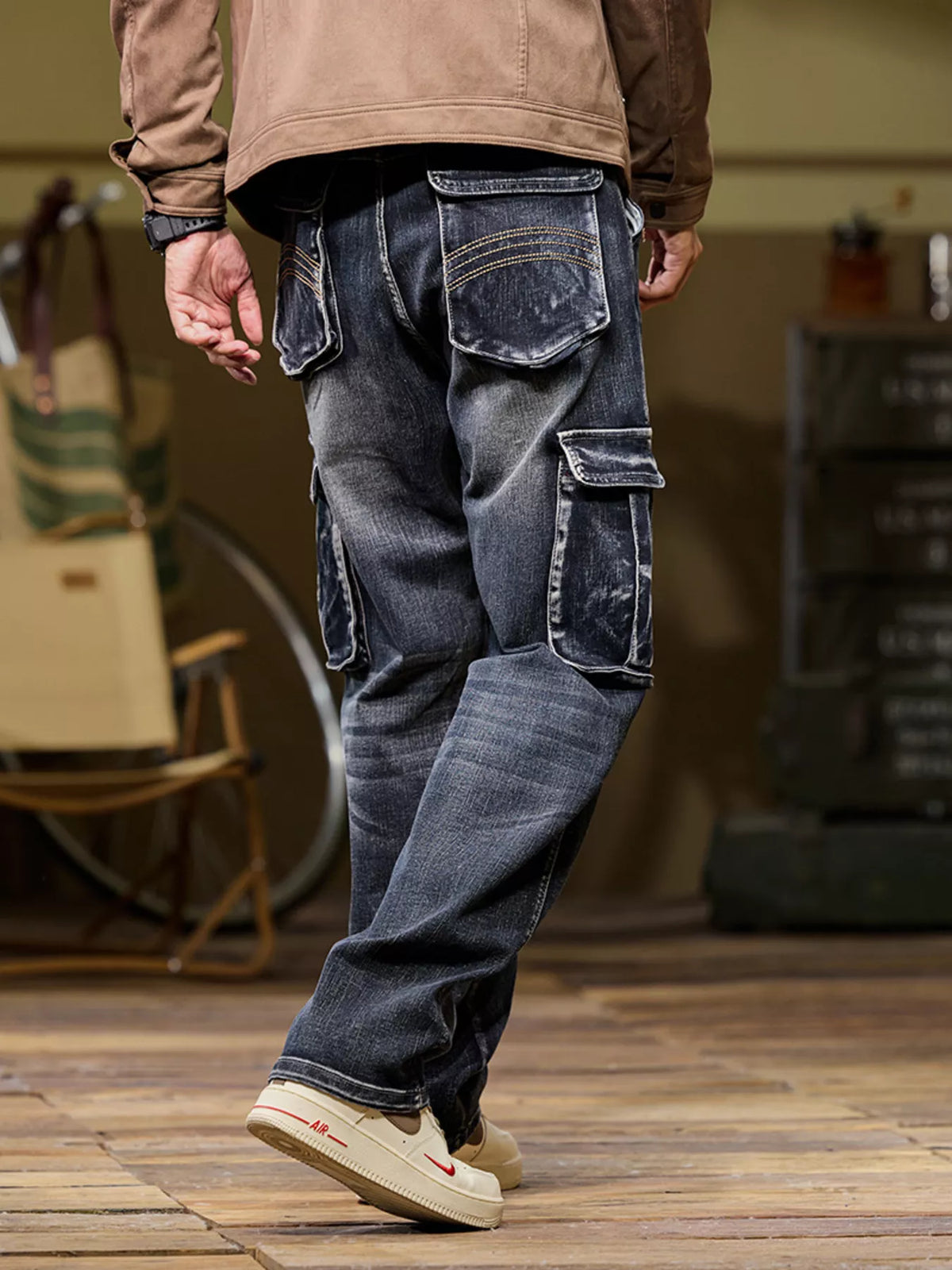 Men's black vintage wash loose fit cargo jeans with utility pockets, back view