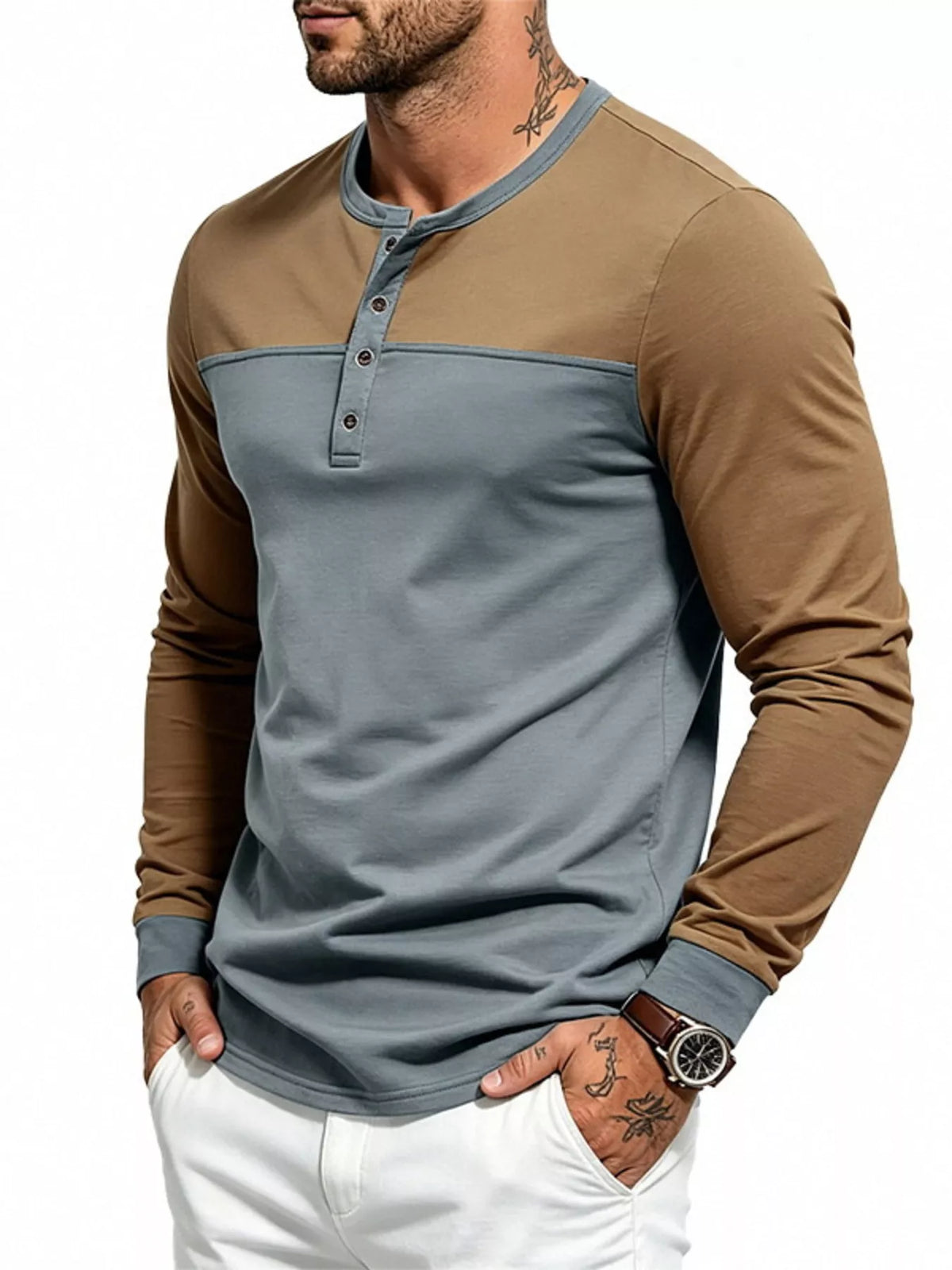 Man wearing a gray and brown color block long sleeve Henley shirt, angled front view
