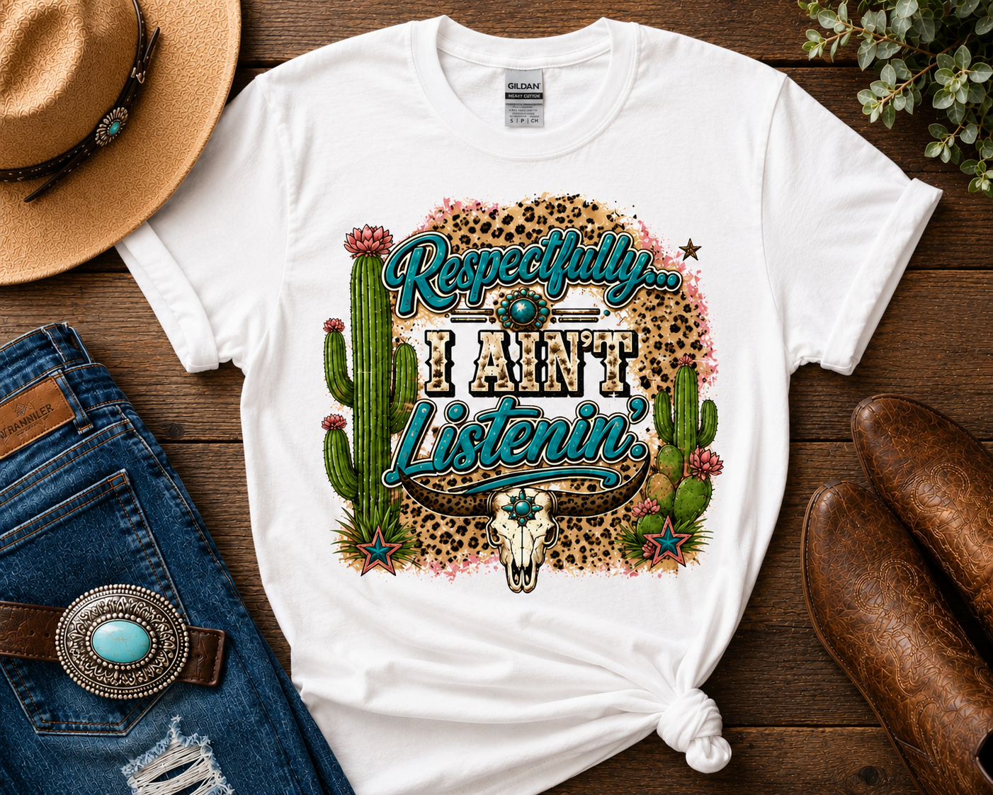 Respectfully I Ain't Listenin' funny southern western graphic tee featuring turquoise accents, leopard print, cactus artwork, longhorn skull design, and boutique cowgirl style on a white Gildan shirt.