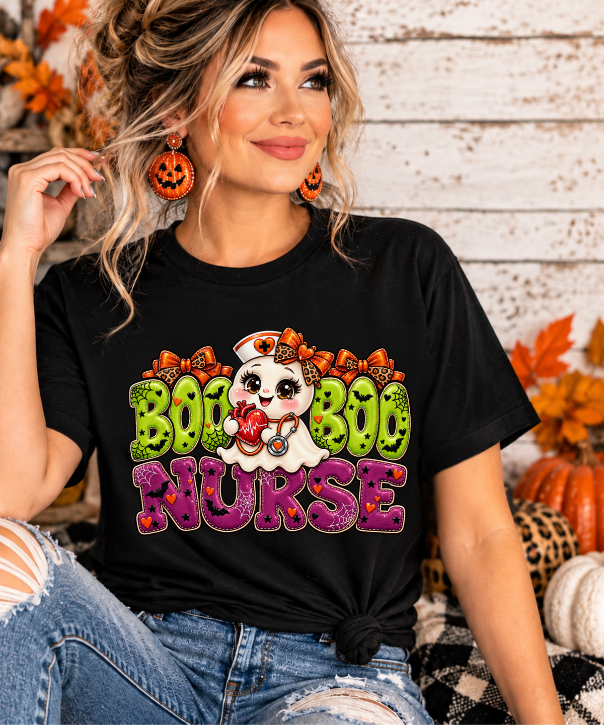 Close-up of Boo Boo Nurse Halloween shirt design featuring a cute ghost nurse, orange leopard bows, stethoscope and colorful lettering.