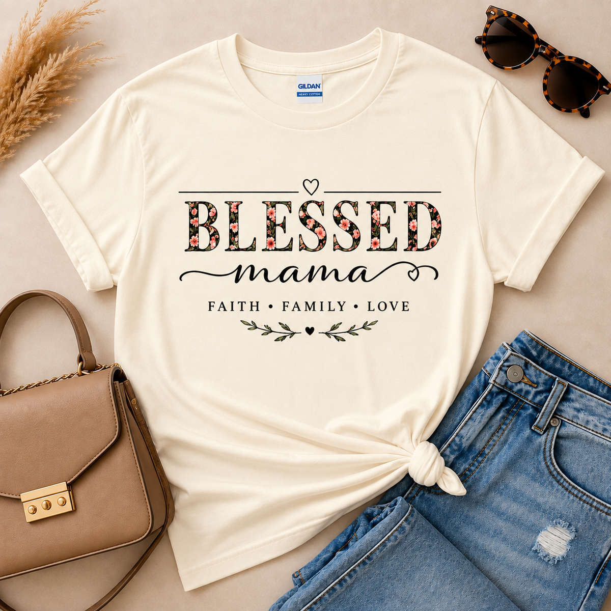 Blessed Mama Faith Family Love floral graphic shirt in Gildan natural, styled with blue jeans and neutral accessories.
