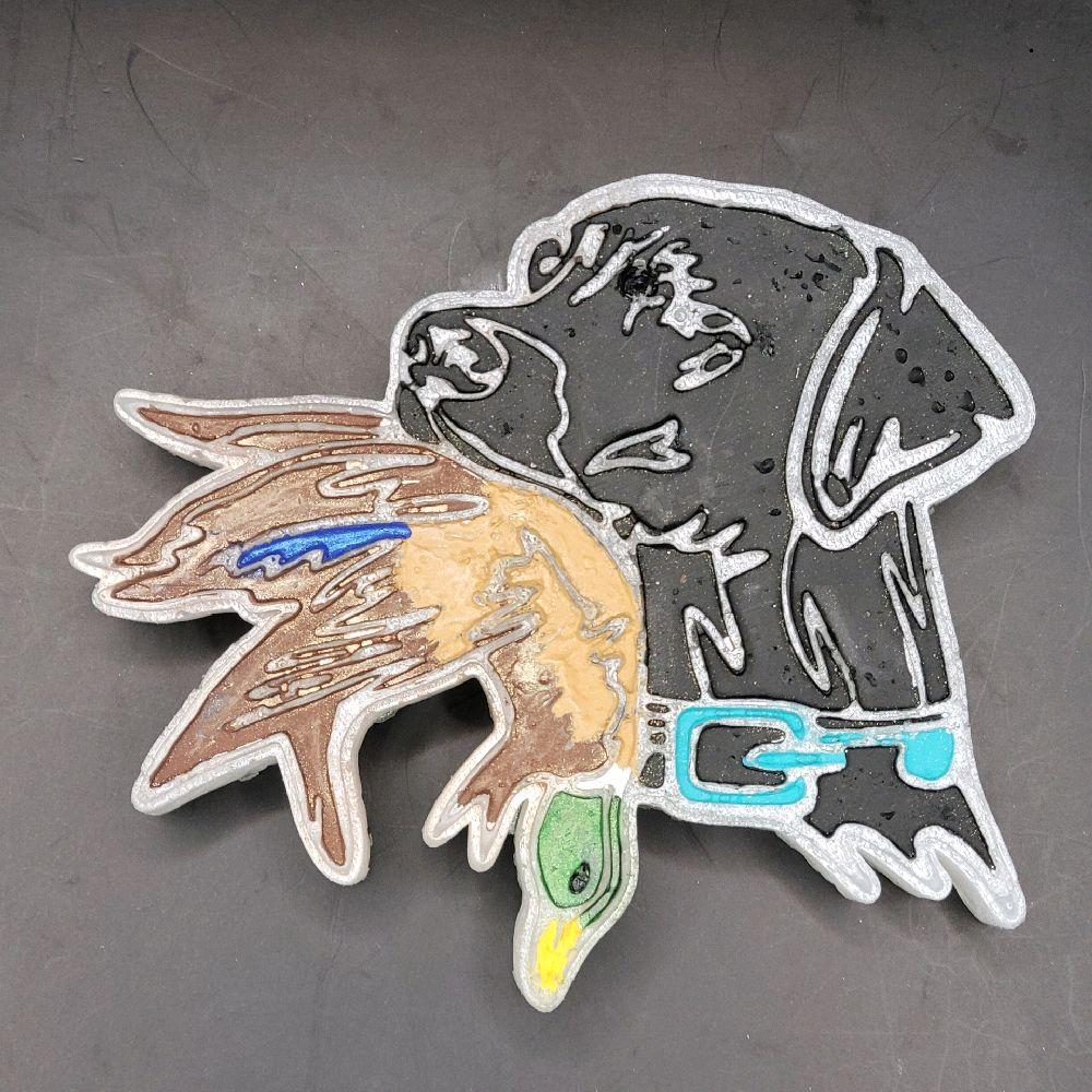 Black Lab and duck car freshie with turquoise collar displayed on a gray surface.