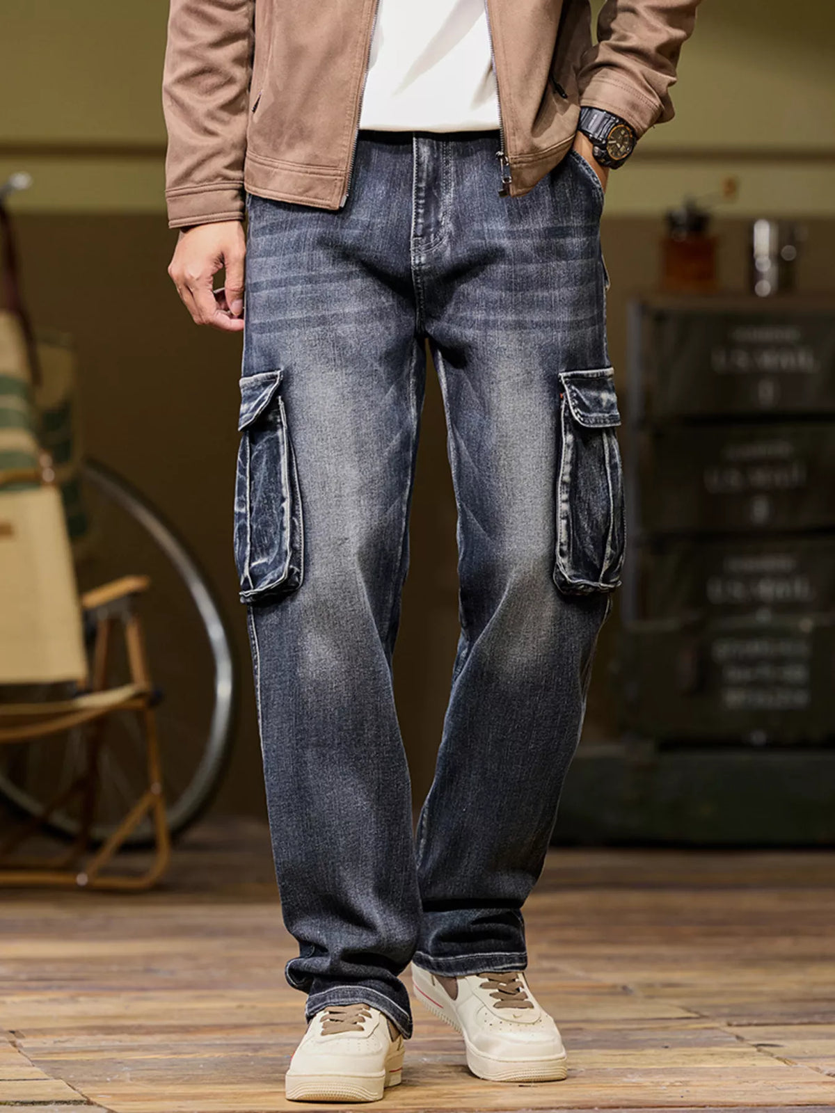 Men's black vintage wash loose fit cargo jeans with side pockets, front view