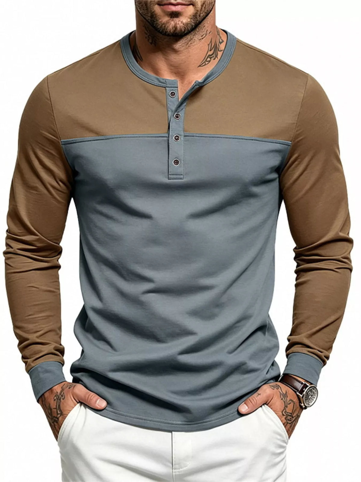 Man wearing a gray and brown color block long sleeve Henley shirt, front view