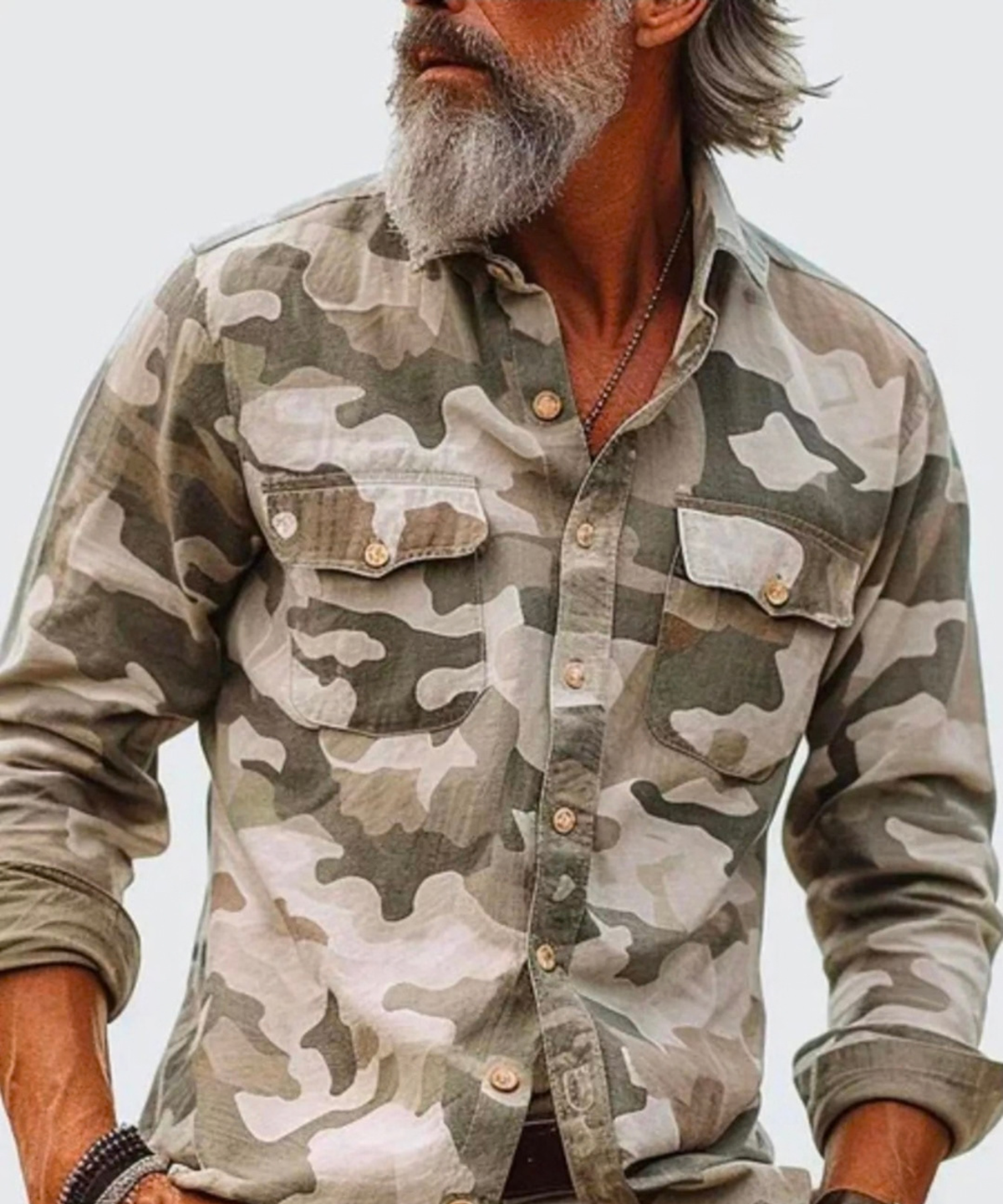 Man wearing a tan camouflage button-up shirt with dual chest pockets, front view