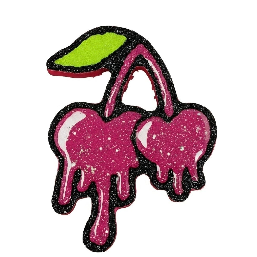 Pink dripping cherry car freshie with black glitter outline and green leaf by Sassy Southern Creations.
