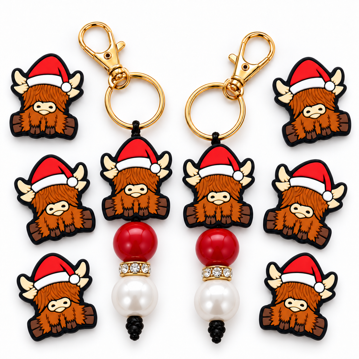 Christmas Highland cow keychain design with 20 mm red and pearl-white acrylic beads beneath the focal, rhinestone spacer between the round beads, and gold-tone clasp; display shows multiple examples, purchase includes one keychain.