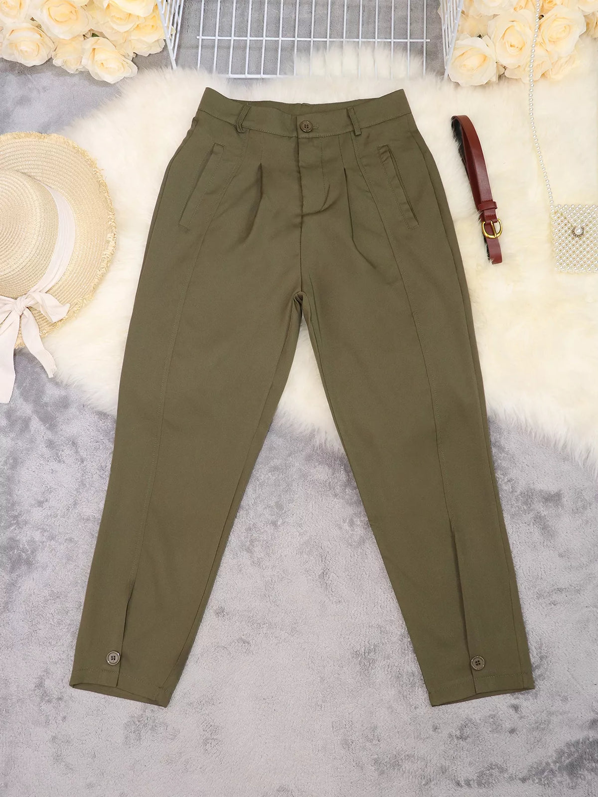 Back view of women's black high-waisted pleated pants