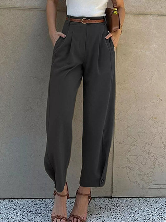 Woman wearing black high-waisted pleated straight-leg pants