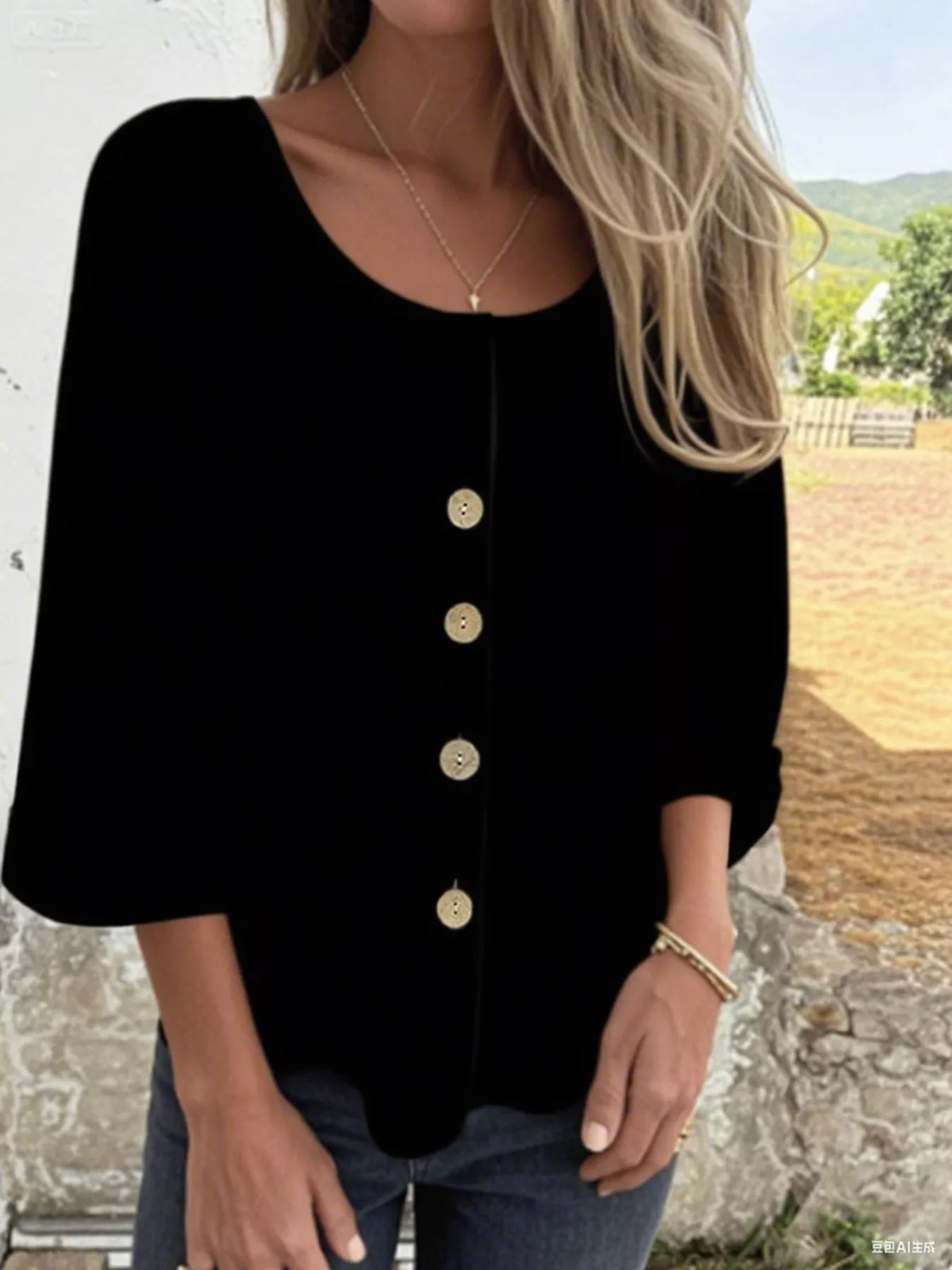 Woman wearing a black V-neck button-front 3/4 sleeve blouse