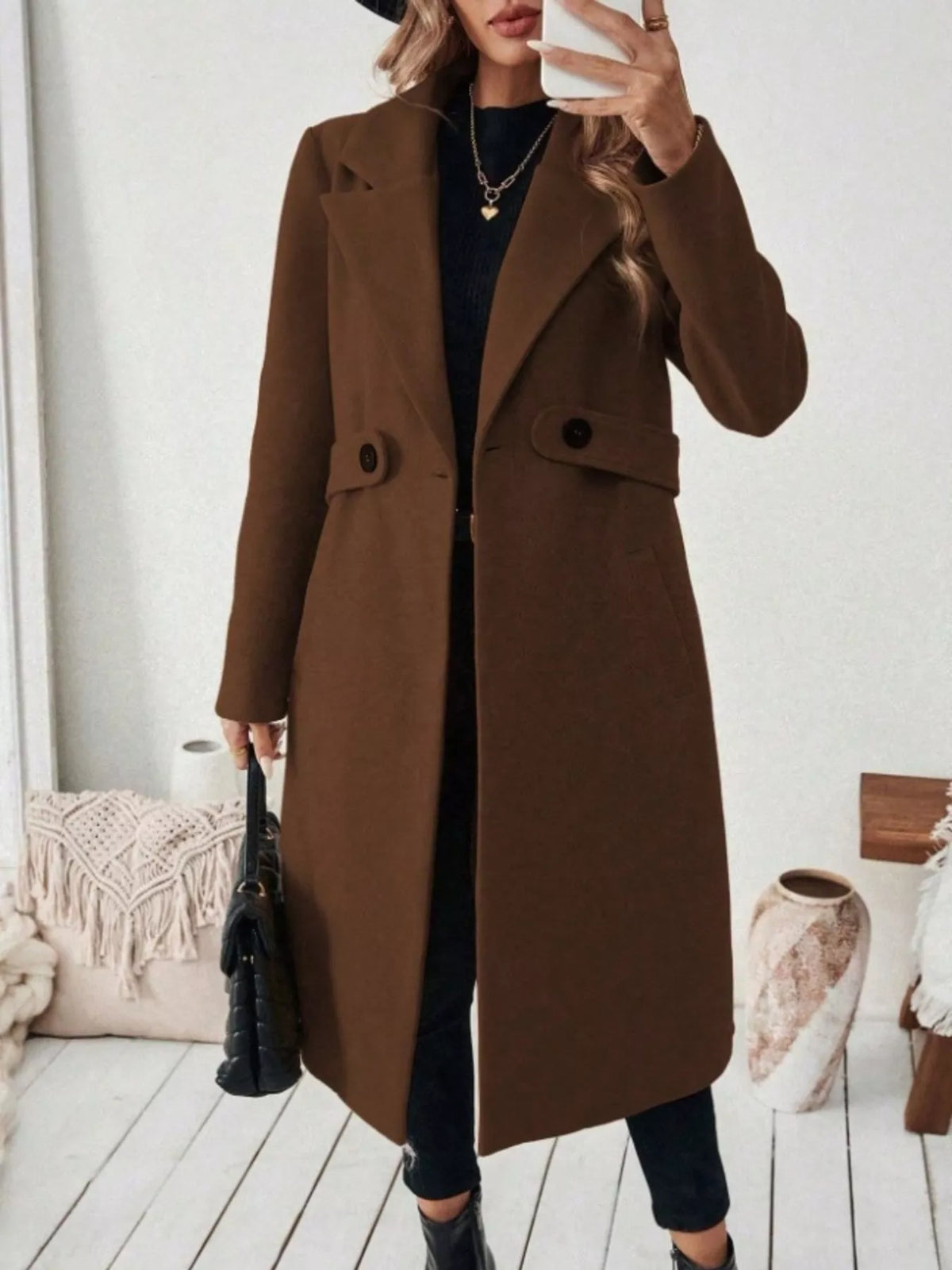Woman wearing a brown belted lapel collar coat with pockets