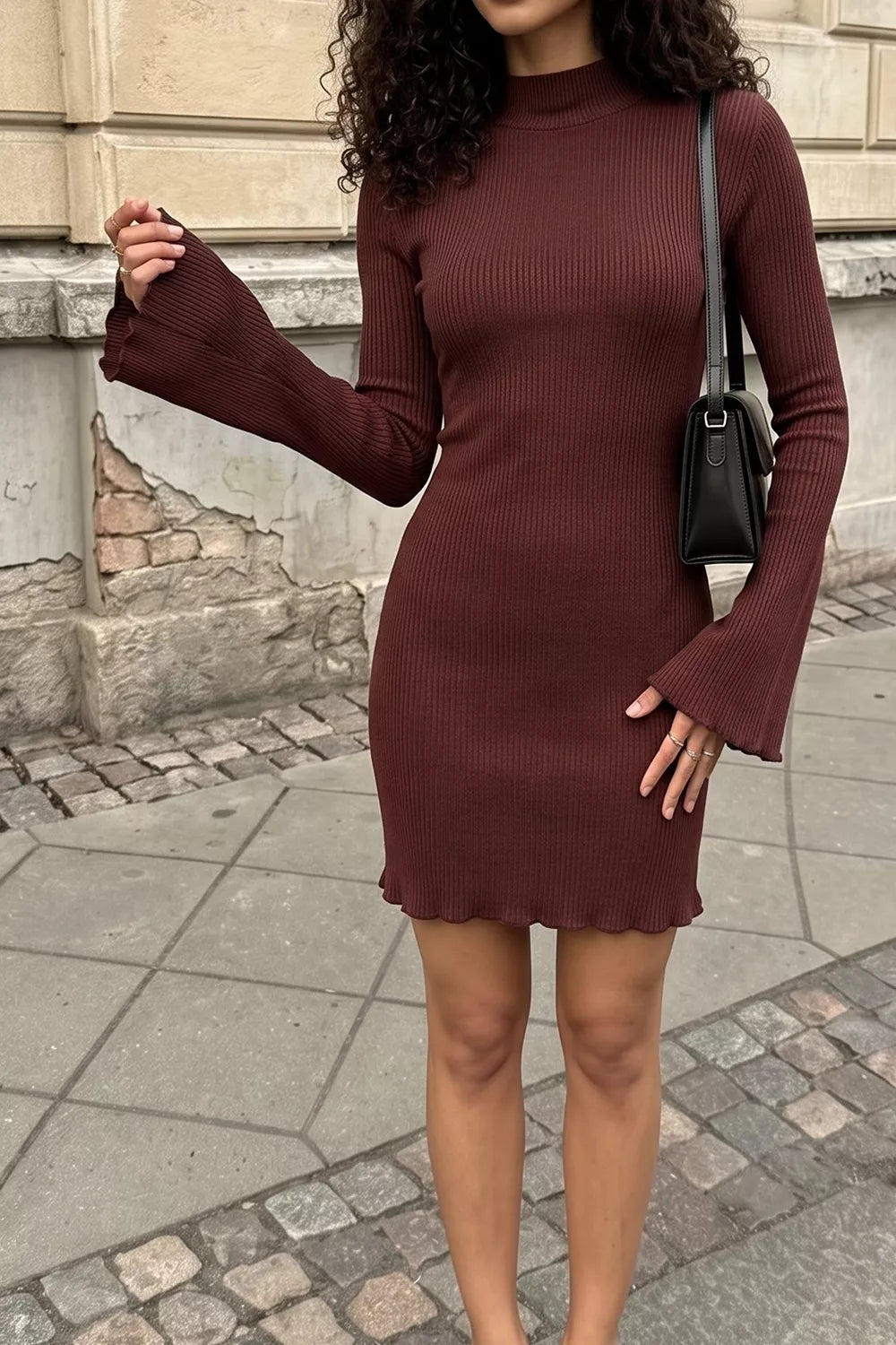 Close-up of burgundy ribbed knit bodycon mini dress fabric and fit