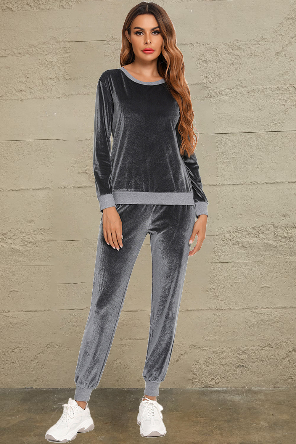 Woman wearing a charcoal round neck long sleeve loungewear set with matching pants, full-length view
