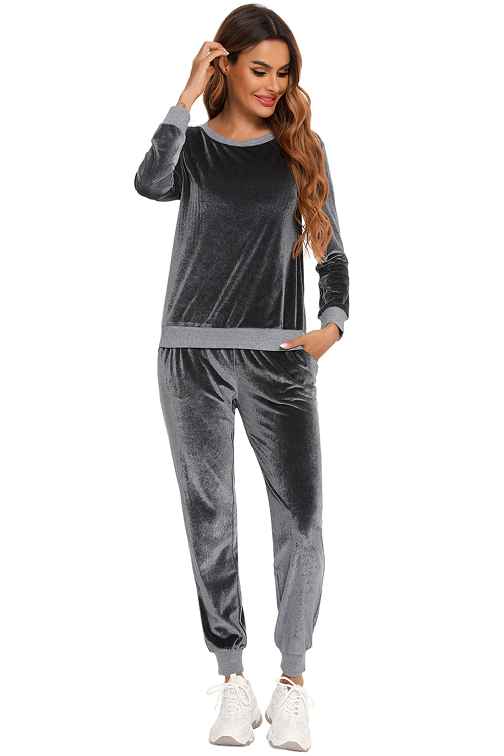 Woman wearing a charcoal round neck long sleeve loungewear set with pocketed pants, front view