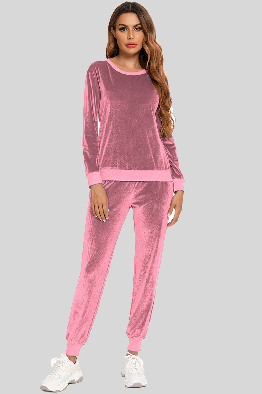 Woman wearing a dusty pink round neck long sleeve loungewear set with matching pants, full-length view