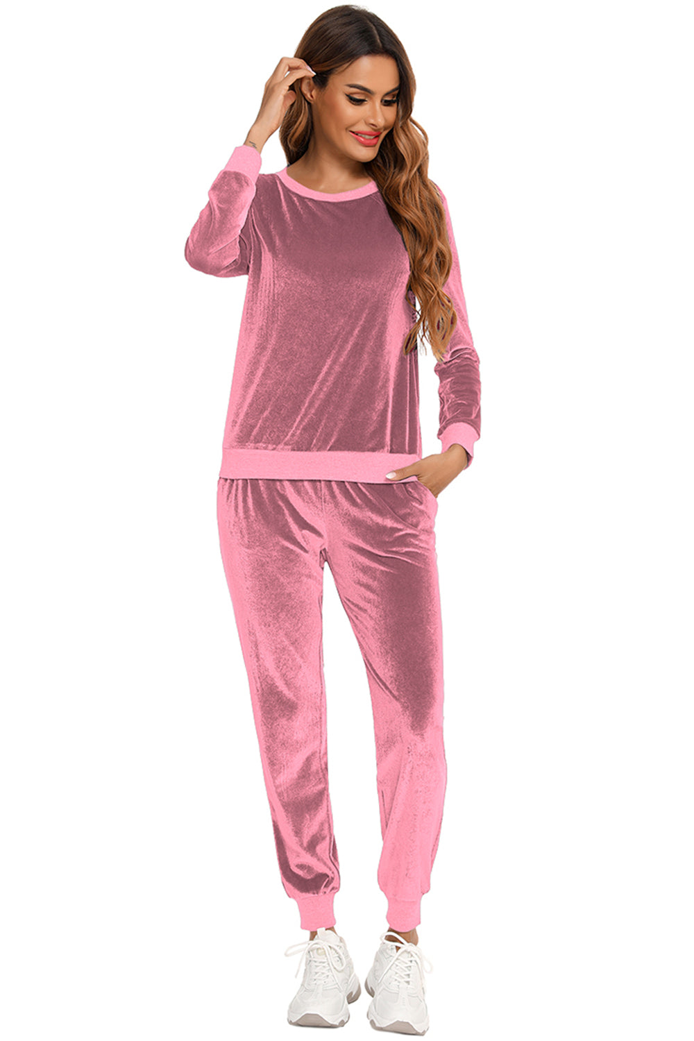 Woman wearing a dusty pink round neck long sleeve loungewear set with pocketed pants, front view