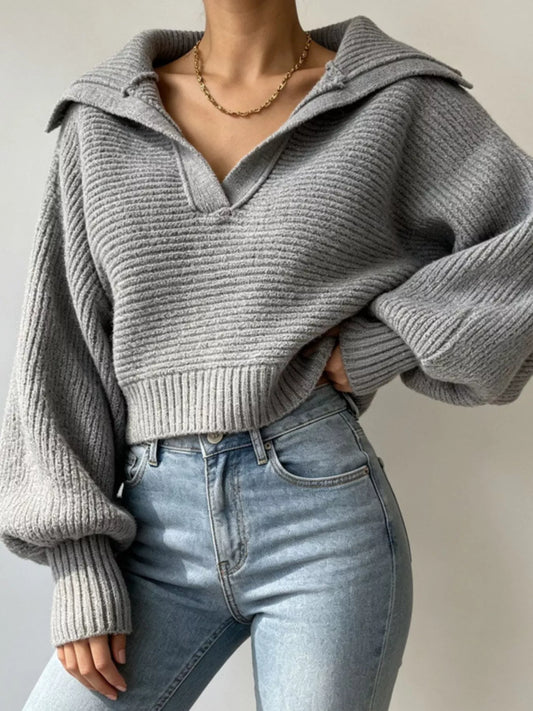 Woman wearing a gray oversized collar ribbed cropped sweater