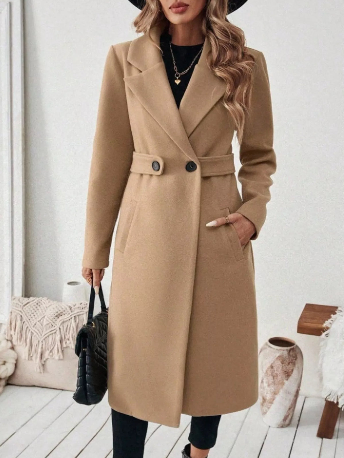 Woman wearing a khaki belted lapel collar coat with pockets