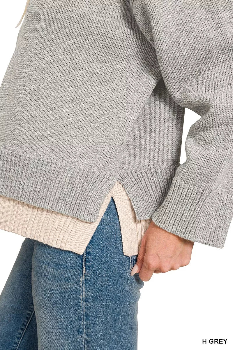 Close-up of the layered hem and side slit on the Zenana heather gray sweater